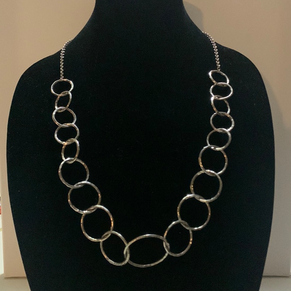 Silver necklace, adjustable in length, 16” and longer.